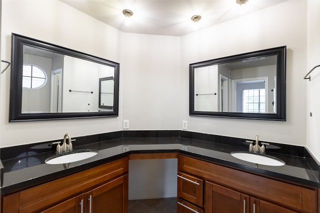 bathroom with vanity and tile patterned flooring