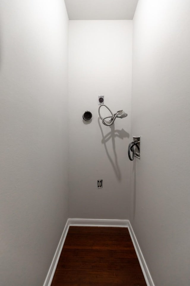 laundry room with electric dryer hookup and wood-type flooring