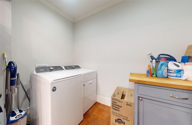 clothes washing area with separate washer and dryer, tile patterned floors, and crown molding