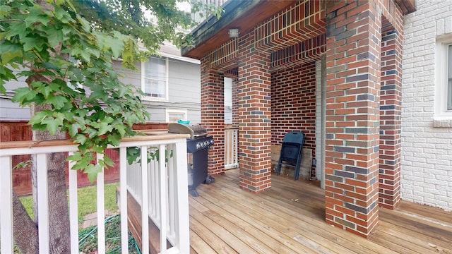 wooden terrace featuring area for grilling