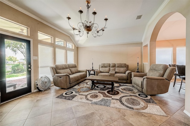 living room with ornamental molding, a healthy amount of sunlight, light tile patterned floors, and a chandelier