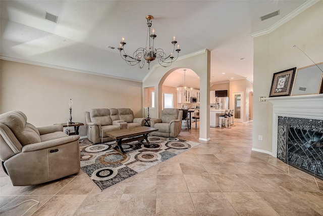 living room featuring crown molding, light tile patterned flooring, and a chandelier