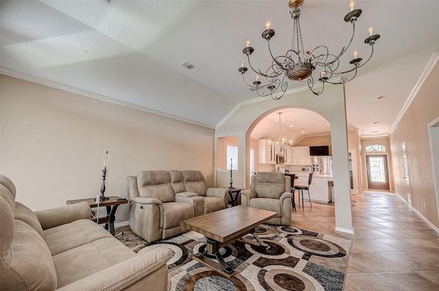 tiled living room featuring vaulted ceiling, crown molding, a chandelier, and a healthy amount of sunlight