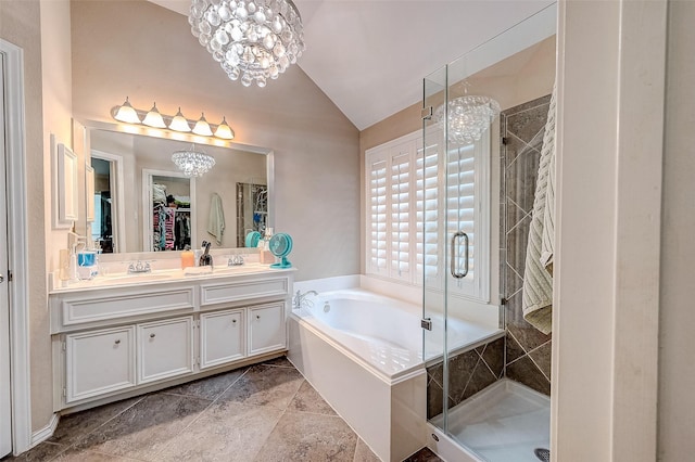 bathroom featuring an inviting chandelier, vanity, lofted ceiling, and plus walk in shower