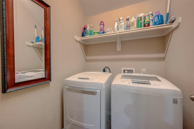 washroom with independent washer and dryer