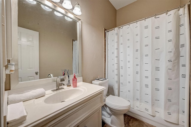 full bathroom featuring vanity, shower / bath combination with curtain, tile patterned floors, and toilet