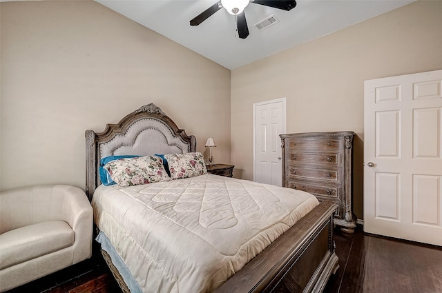 bedroom featuring vaulted ceiling, ceiling fan, and dark hardwood / wood-style flooring