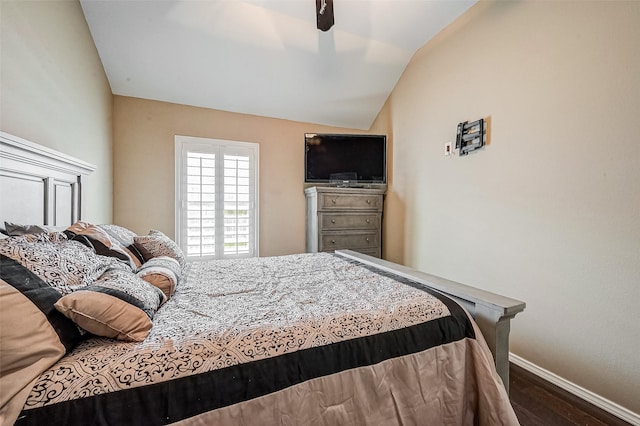 bedroom with lofted ceiling, hardwood / wood-style floors, and ceiling fan