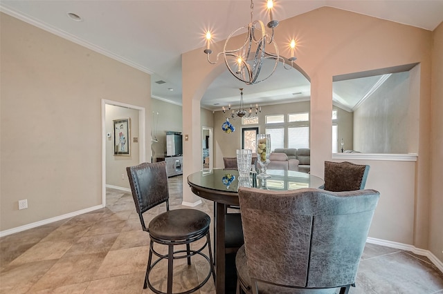 dining room featuring crown molding, vaulted ceiling, and a chandelier