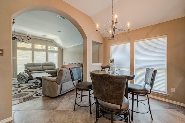 dining room featuring lofted ceiling and an inviting chandelier