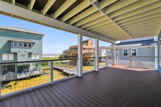 wooden terrace featuring a water view