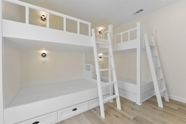 bedroom with light wood-type flooring