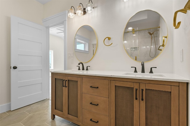 bathroom with vanity, walk in shower, and tile patterned flooring