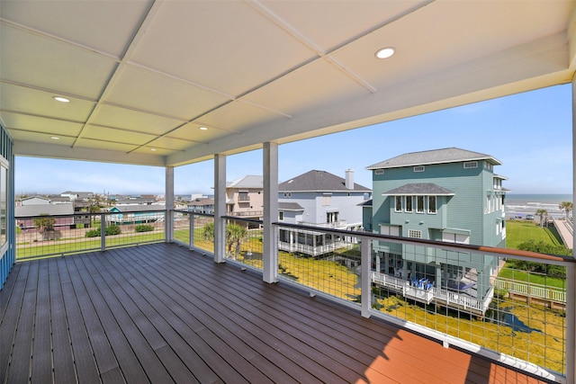 wooden terrace with a water view