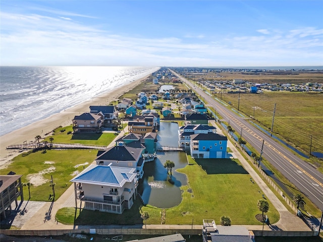 bird's eye view with a water view and a view of the beach