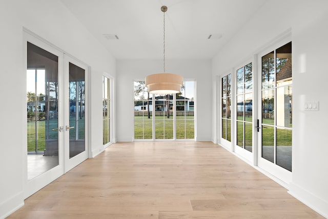 unfurnished sunroom featuring french doors and visible vents