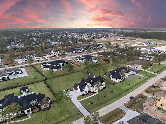 aerial view at dusk with a residential view