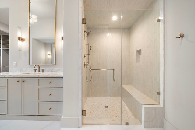 bathroom featuring a stall shower and vanity