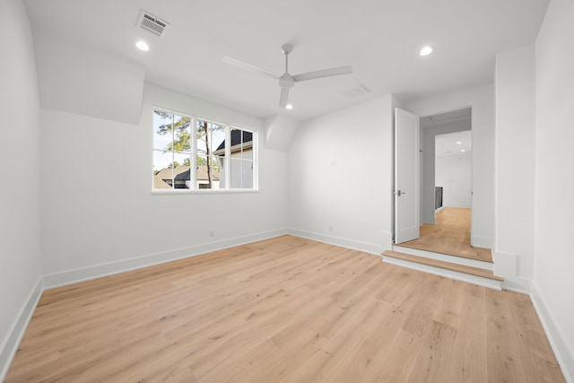 interior space featuring light wood finished floors, baseboards, visible vents, and recessed lighting