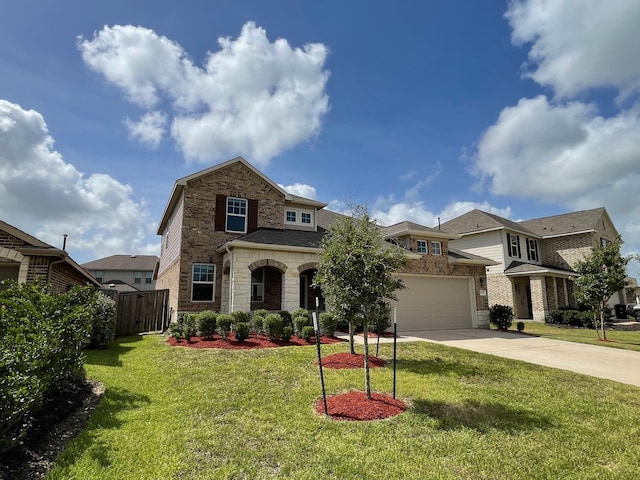 view of front of property featuring a garage and a front lawn