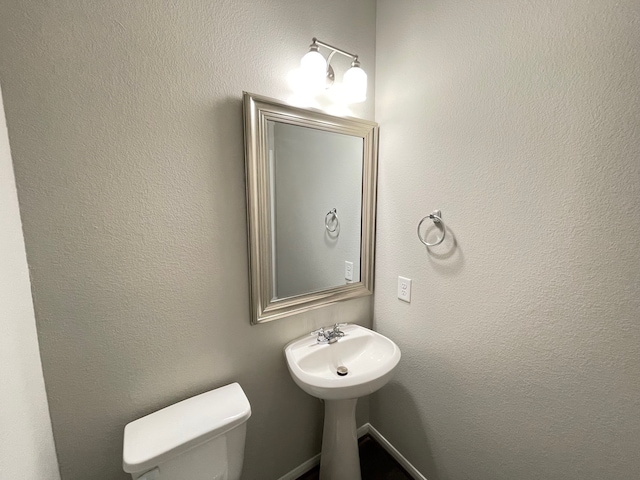 bathroom featuring toilet