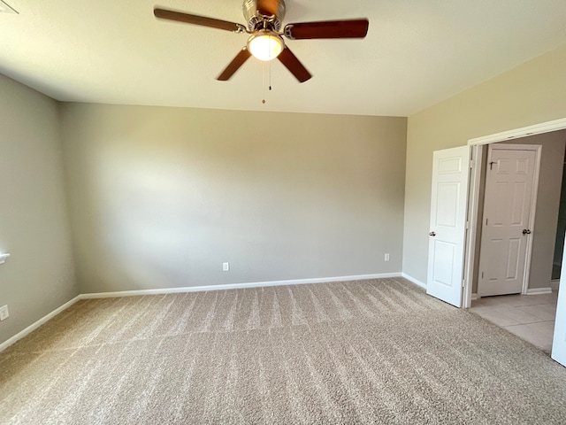 carpeted empty room with ceiling fan