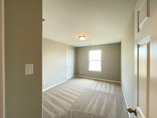 empty room featuring carpet flooring