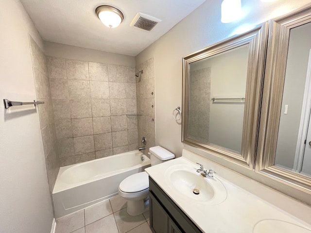 full bathroom with vanity, toilet, tiled shower / bath, and tile patterned flooring