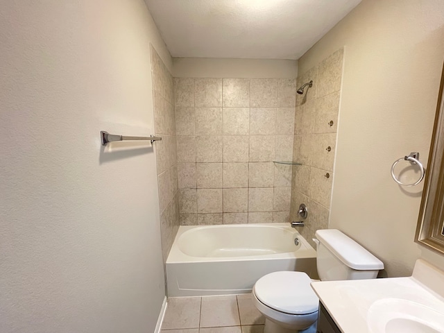 full bathroom with vanity, tile patterned flooring, tiled shower / bath, and toilet