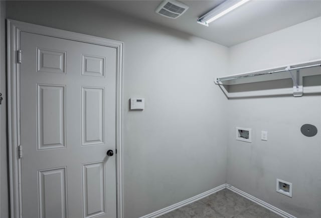 clothes washing area featuring light tile patterned floors and washer hookup