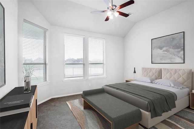 carpeted bedroom featuring vaulted ceiling and ceiling fan