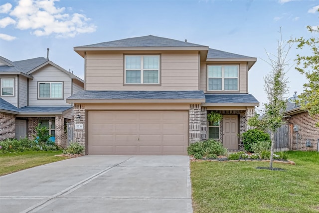 view of front of property with a garage and a front lawn