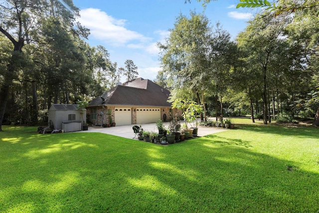 view of front of home with a front yard, a garage, and a storage shed