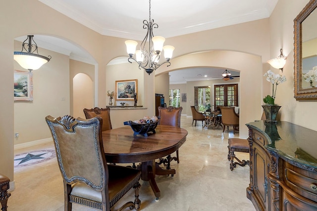 dining room with ceiling fan with notable chandelier and ornamental molding