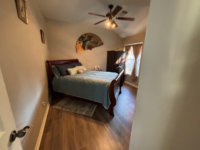 bedroom with lofted ceiling, wood-type flooring, and ceiling fan