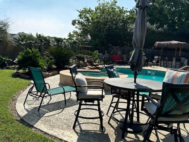 view of swimming pool featuring a patio area