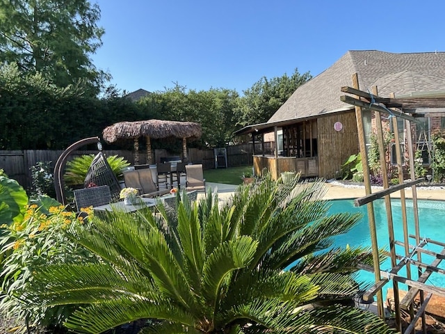 view of swimming pool with a patio