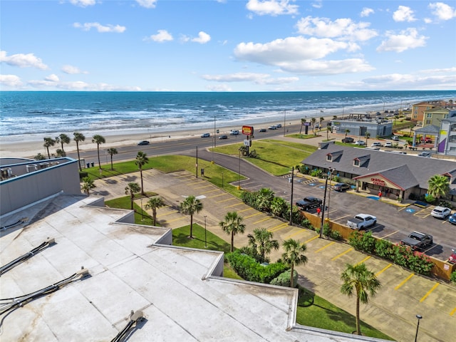 bird's eye view with a view of the beach and a water view