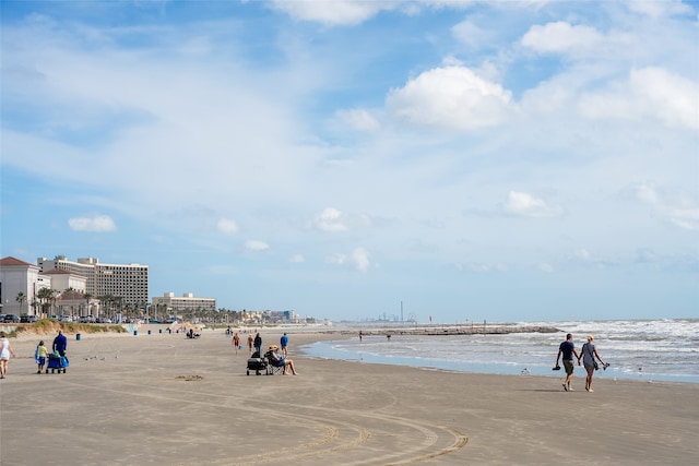 surrounding community featuring a view of the beach and a water view