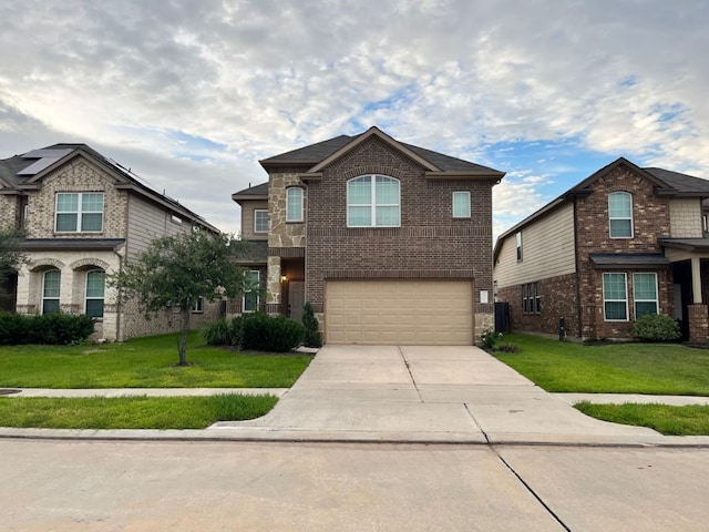 view of front of home with a garage and a front yard