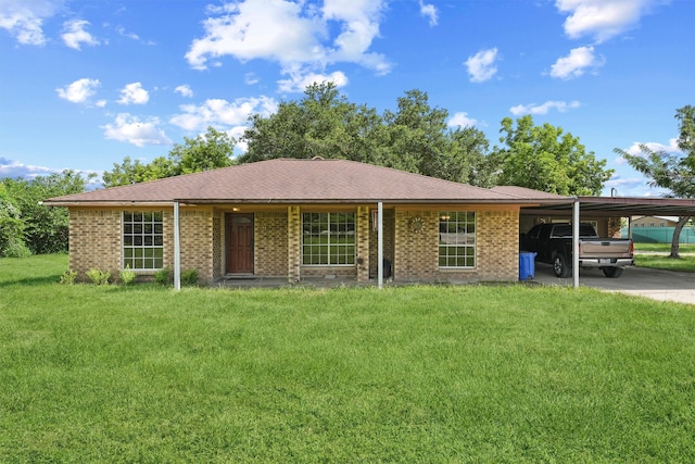 ranch-style house featuring a carport and a front yard