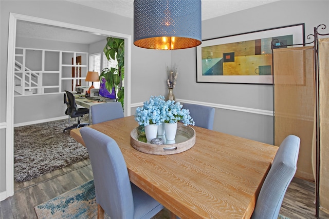 dining space featuring hardwood / wood-style flooring