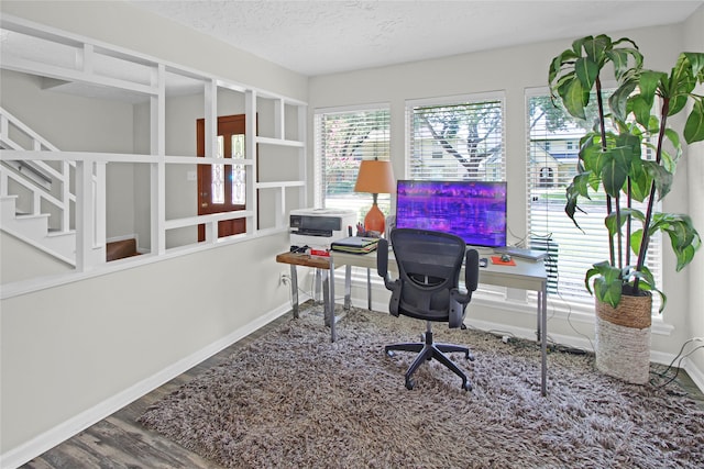 office space featuring a textured ceiling and hardwood / wood-style floors