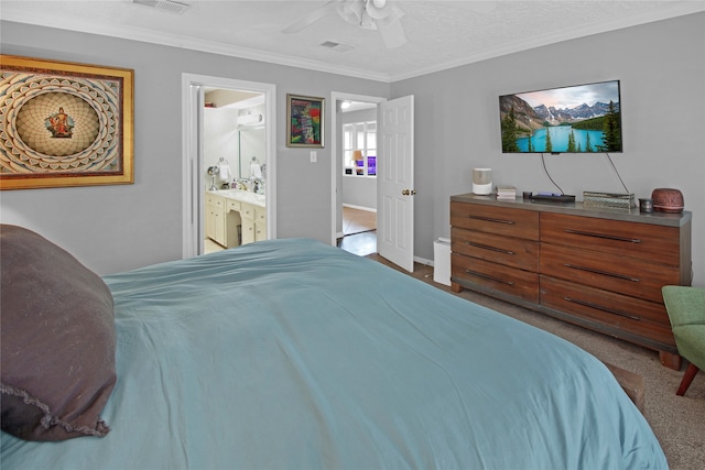 carpeted bedroom featuring ornamental molding, connected bathroom, and ceiling fan