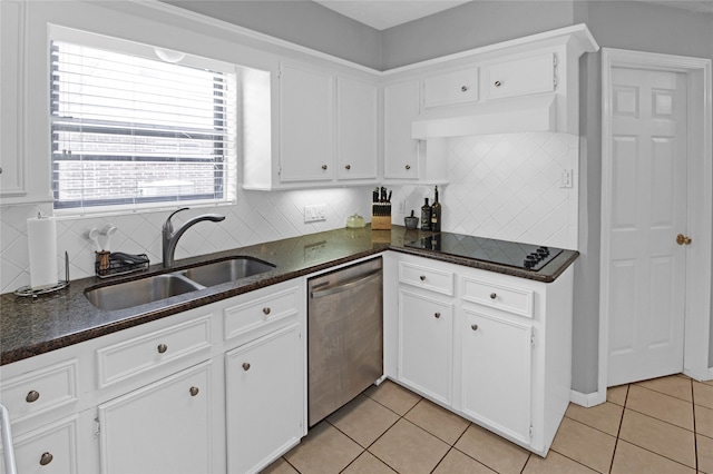 kitchen featuring sink, stainless steel dishwasher, light tile patterned floors, and backsplash