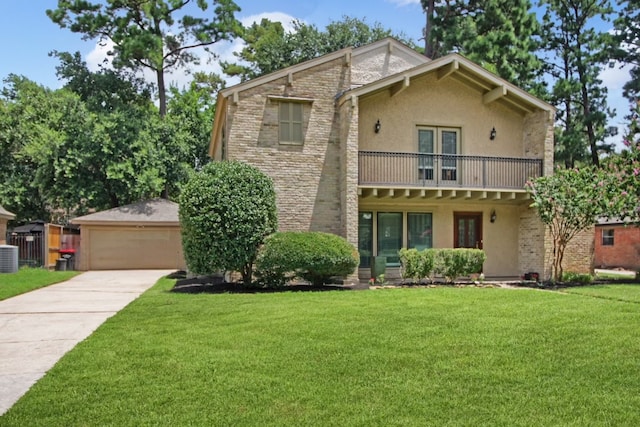 view of front property featuring a balcony, a garage, central AC unit, and a front yard