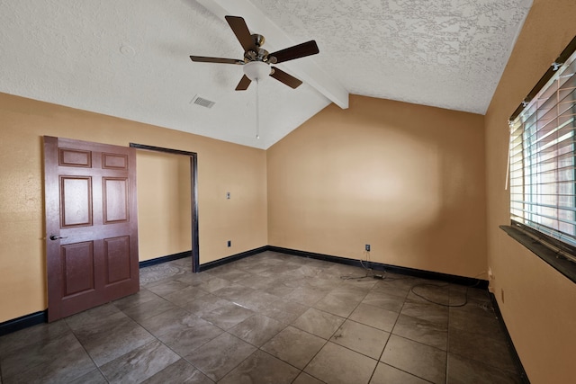 spare room with vaulted ceiling with beams, a textured ceiling, and ceiling fan