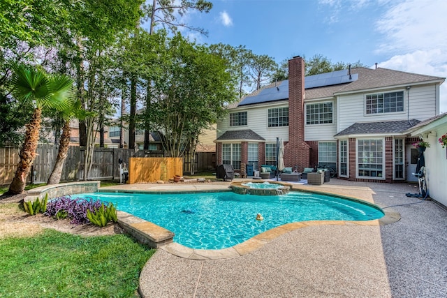 view of swimming pool with an in ground hot tub and a patio