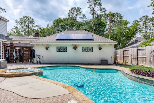 view of pool with an in ground hot tub, a patio, and central AC