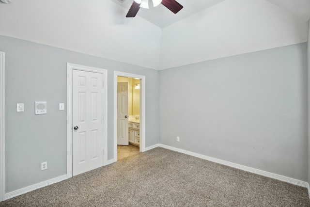 unfurnished bedroom featuring light carpet, ceiling fan, and connected bathroom